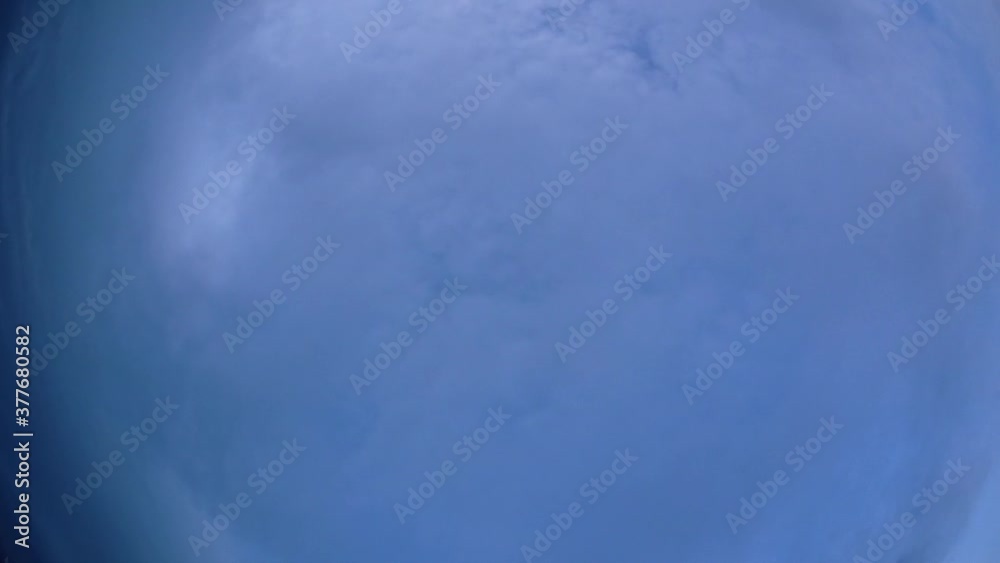 Blue sky and layer of clouds moving about in a fine sunny afternoon; time-lapse of clouds with different forms and thickness moving from every direction was a fantastic thing to watch. Blue sky and layer of clouds moving about in a fine sunny afternoon; time-lapse of clouds with different forms and thickness moving from every direction was a fantastic thing to watch.