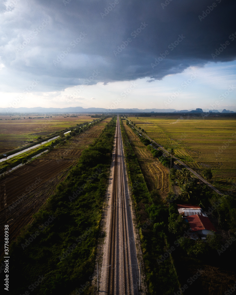 Railway track heading into the horizon in Kodiang, Malaysia