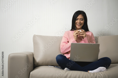 Young beautiful happy women using laptop working from home