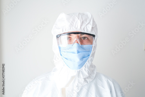 Young doctor wearing a protective suit. professional doctor.