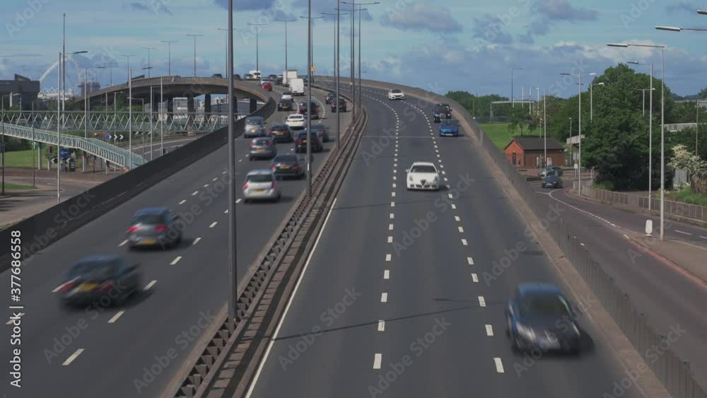 Motorway traffic on North London dual carriageway. Fast moving vehicular traffic on North Circular Road A406 in North London, UK Motorway traffic on North London dual carriageway. Fast moving vehicular traffic on North Circular Road A406 in North London, UK
