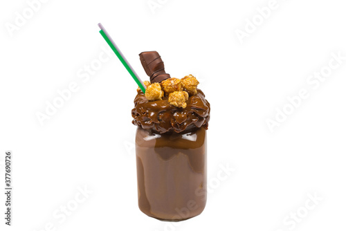 Chocolate milkshake with whipped cream, cookies, waffles, served in glass mason jar. "Freak or crazy" sweet shake. Isolated.