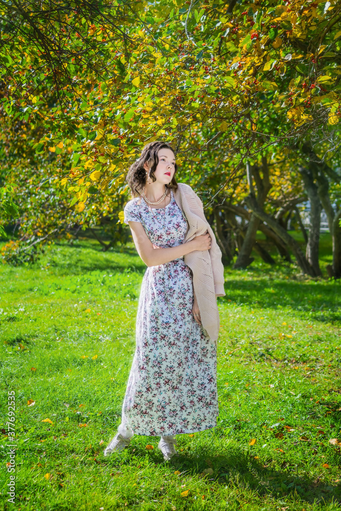 Young sad women in a park on a warm autumn day. Young sad women in a park on a warm autumn day.