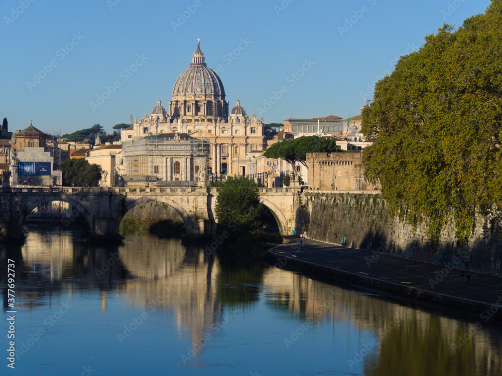 View of St. Peter's Basilica and the Tiber river in Rome on a Sunny day. Rome, Italy.