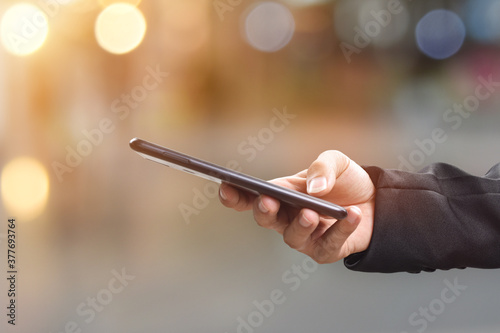 Close-up image of male hands using mobile smartphone. Business technology and social networks concept