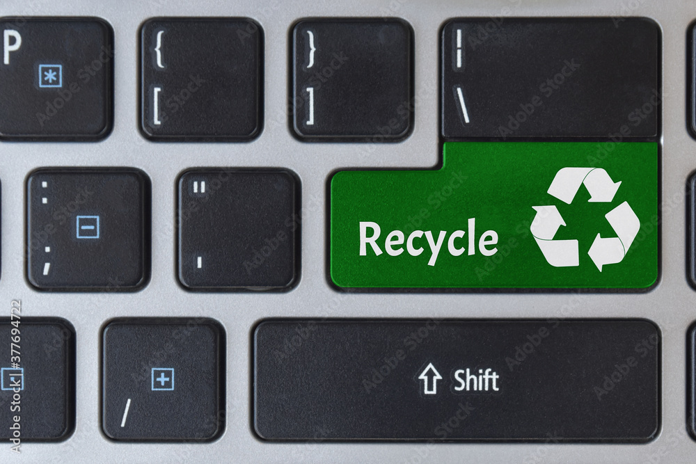 Save of environment concept. Logo recycle icon symbol on laptop keyboard. Save of environment concept. Logo recycle icon symbol on laptop keyboard.