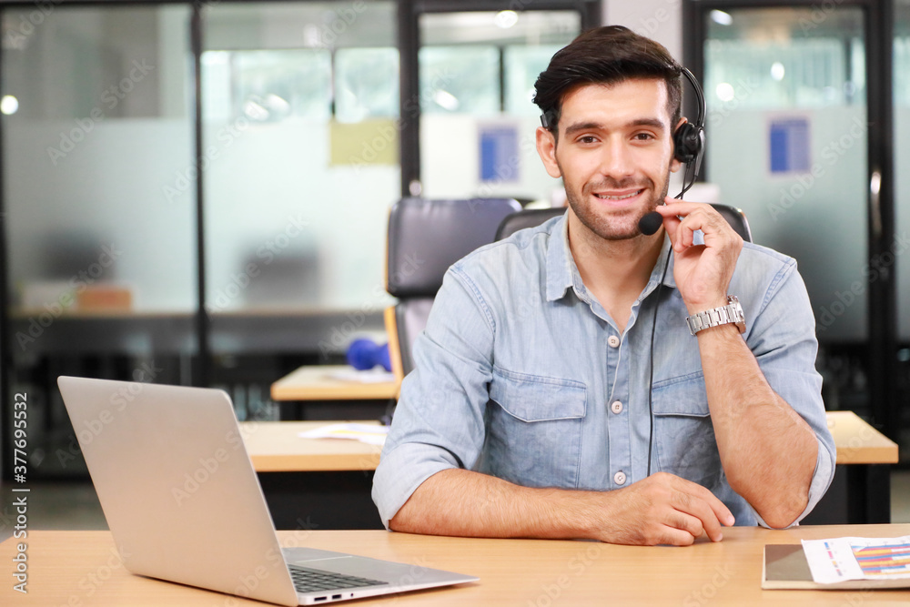 Fototapeta premium Caucasian businessman IT operator answering online phone call from customer as 24/7 customer service with copy space