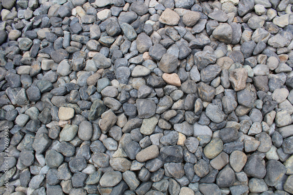 Grey pebble ground - background texture Grey pebble ground - background texture