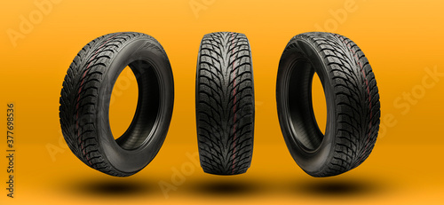 winter tires friction close-up on a bright yellow-orange background photo