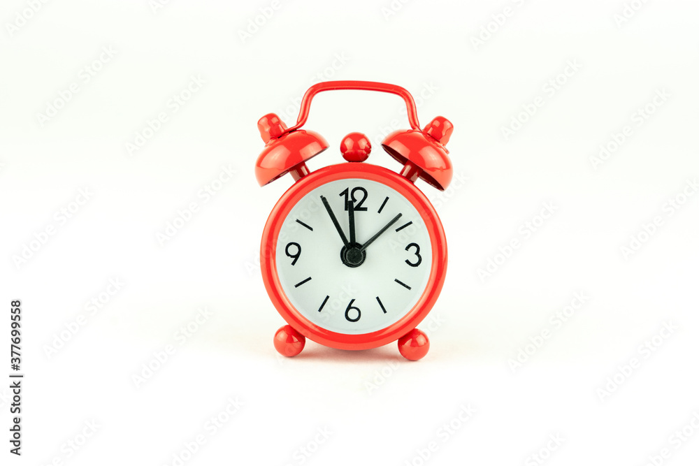 the red alarm clock is isolated on a white background the red alarm clock is isolated on a white background