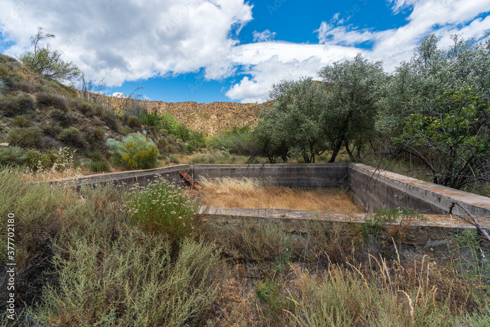 small pool without water in the field