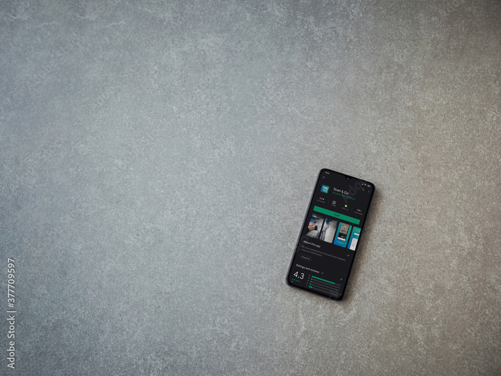 Lod, Israel - July 8, 2020: Scan & Go app play store page on the display of  a black mobile smartphone on wooden background. Top view flat lay with cop  Stock Photo - Alamy