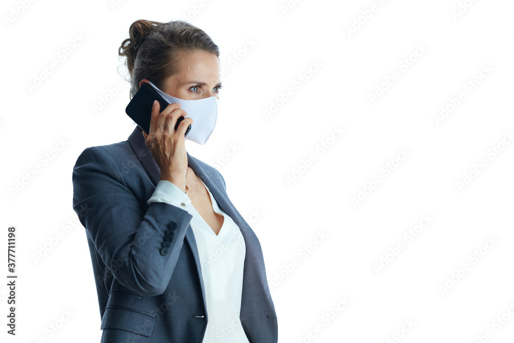 young female in grey suit on white looking into distance young female in grey suit on white looking into distance