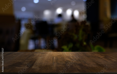 Wood Table Top in Blur Background room interior with empty copy space.