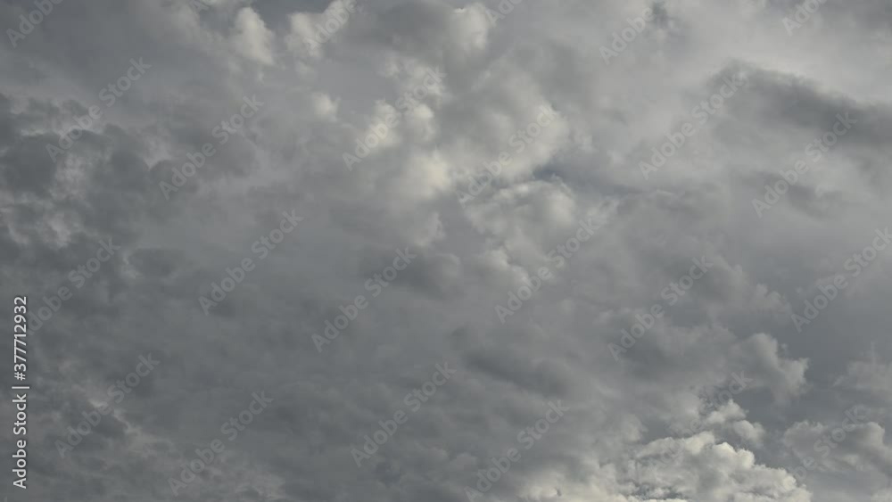 Time lapse of dramatic fluffy white and grey storm clouds moving through the sky.
Time lapse of dramatic fluffy white and grey storm clouds moving through the sky.