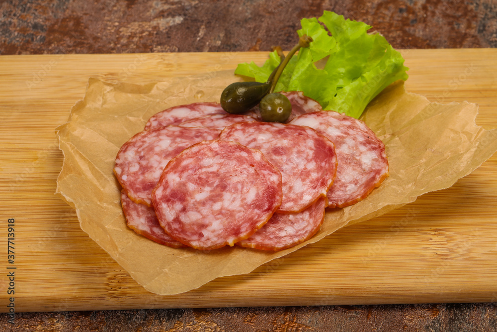 Spanish Salchichon sausage with salad Spanish Salchichon sausage with salad