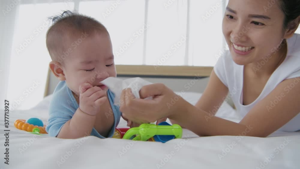 Family concept. Mother is wiping the snot on the baby. 4k Resolution. Family concept. Mother is wiping the snot on the baby. 4k Resolution.