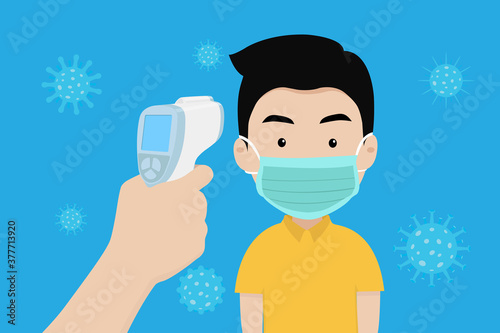 Hand holding infrared thermometer to measure body temperature at forehead result. Man wearing a surgical mask protection of virus. Concept of protection corona virus or covid-19