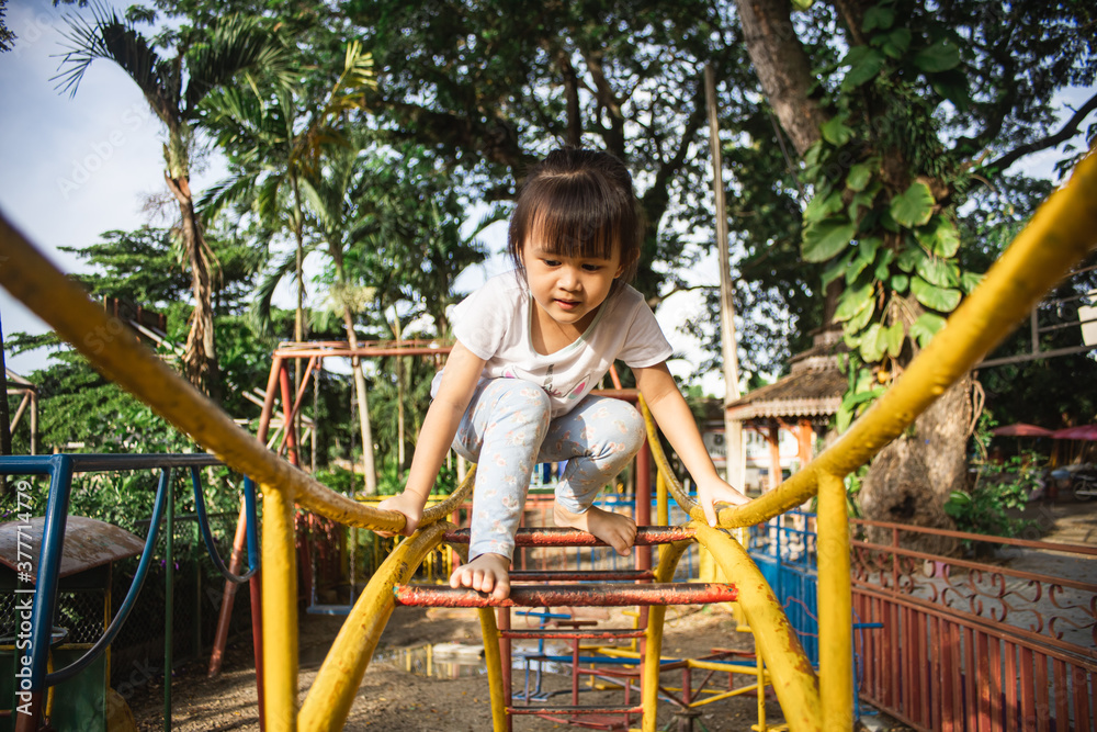 Fototapeta premium Kids climbing in the playground.