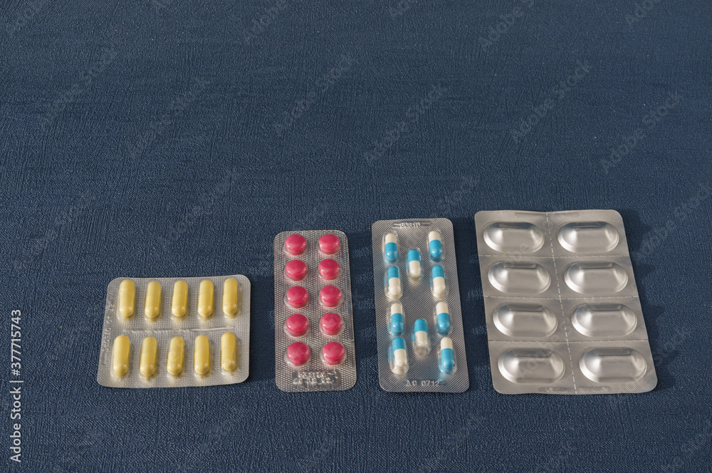 set colorful pills and capsules of drugs lie on blue background. Top view.  Copy space. Isolated. Concept pharmacy, medicine, healthcare, painkillers,  drug, abuse Stock Photo | Adobe Stock