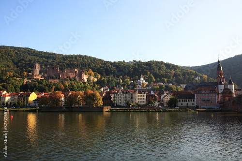 View of Heidelberg old town and Castle with Old Bridge over the river Neckar during sunset in autumn in Heidelberg, Germany