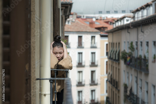 dramatic portrait of young beautiful sad and depressed Asian Chinese woman feeling unhappy and worried suffering some problem going through depression and anxiety crisis © TheVisualsYouNeed