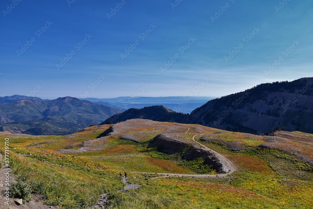 Fototapeta premium Timpanogos hiking trail landscape views in Uinta Wasatch Cache National Forest, around Utah Lake, in the Rocky Mountains in fall. Views of Midway, Heber, Provo city, Salt Lake and Utah County. USA.