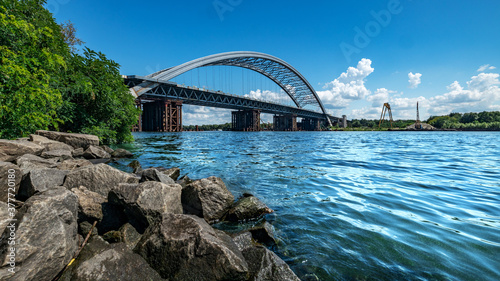Podolsky bridge  panoramic view of the bridge under construction across the Dnieper  clear weather  summer