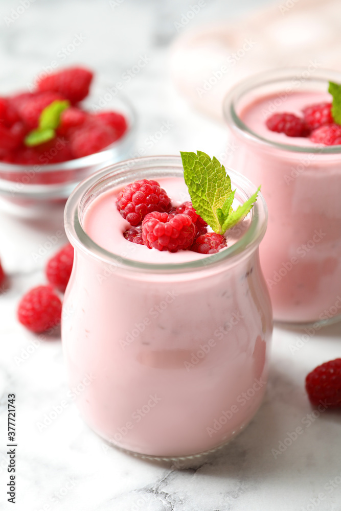 Yummy raspberry smoothie on white marble table, closeup Yummy raspberry smoothie on white marble table, closeup
