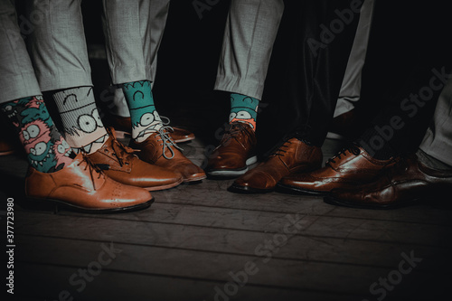 Funny socks of friends at wedding