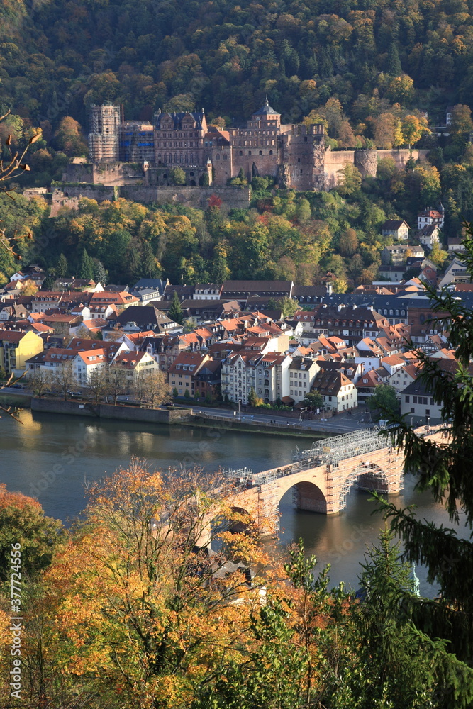 Aerial view of  Heidelberg old town and Castle  with Old Bridge over the river Neckar during sunset in autumn in Heidelberg, Germany