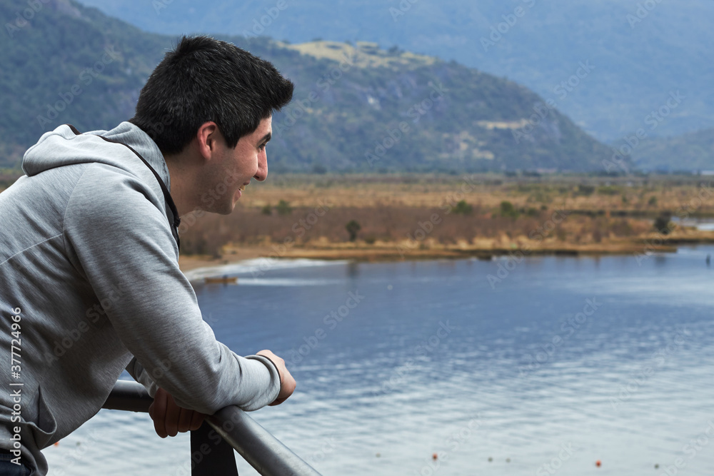 young man looks up on the seashore young man looks up on the seashore