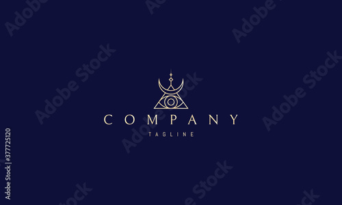 Vector golden logo with an abstract image of the eye in the center of the pyramid and the moon from above.