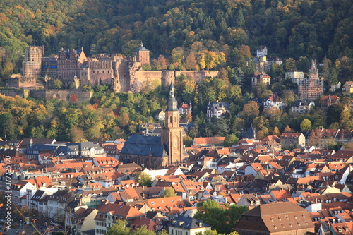 Aerial view of Heidelberg old town and Castle with Church of the Holy Spirit during sunset in autumn in Heidelberg, Germany