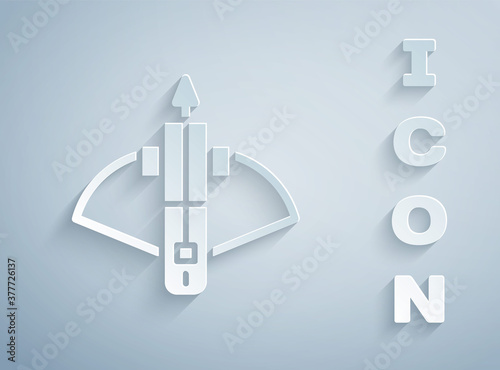Paper cut Battle crossbow with arrow icon isolated on grey background. Paper art style. Vector.