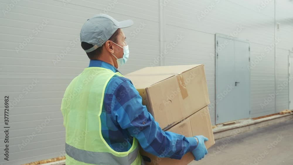 delivery pandemic coronavirus vaccine a goods and food product. courier delivery man delivers food to your home covid. parcel delivery concept. courier carries box from the warehouse coronavirus delivery pandemic coronavirus vaccine a goods and food product. courier delivery man delivers food to your home covid. parcel delivery concept. courier carries box from the warehouse coronavirus
