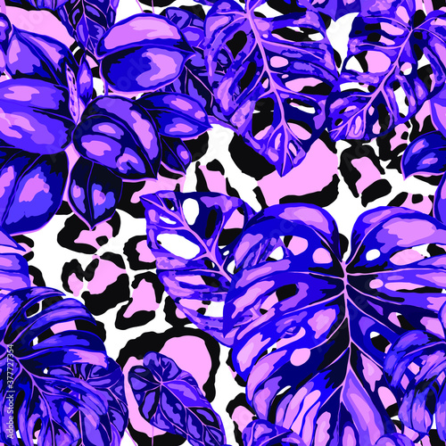 Tropical seamless pattern on animalistic texture. Jungle exotic summer print. Summer tropical leaf. Tropical flower fashion pattern. Floral tropic illustration. Vector seamless pattern.