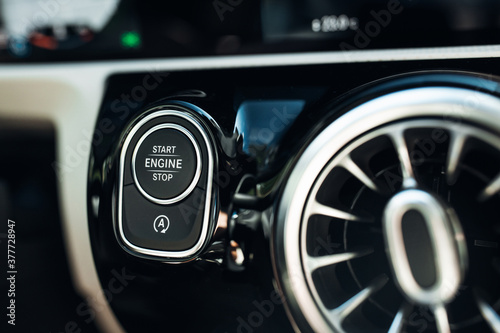 Luxury car engine start and stop button