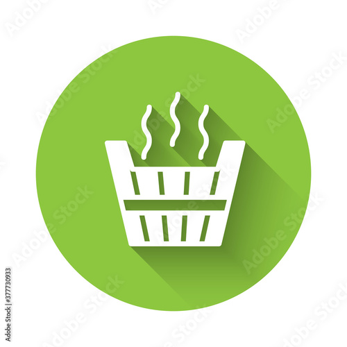 White Sauna bucket icon isolated with long shadow. Green circle button. Vector.