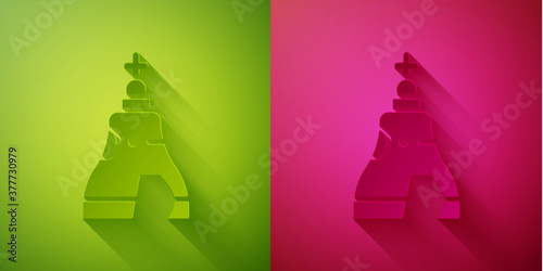 Paper cut The Tsar bell in Moscow monument icon isolated on green and pink background. Paper art style. Vector.
