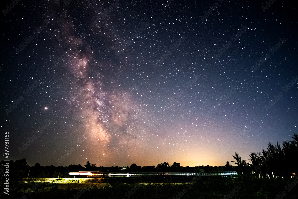 Milky Way Over Express Train at night sky