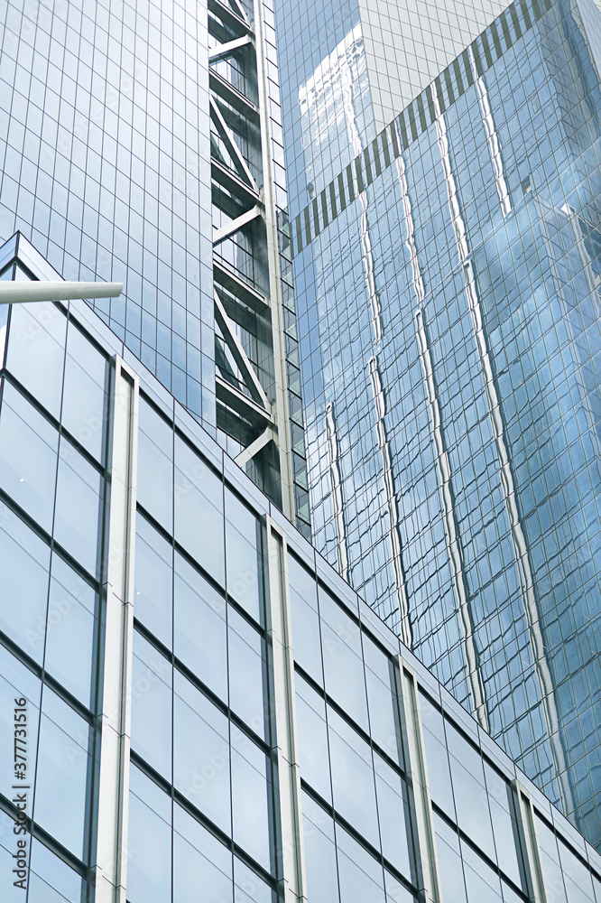 Naklejka premium Glass facade of modern office building close-up