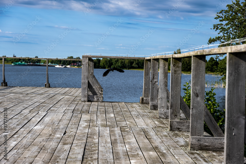 Fototapeta premium rural scenery with gray wooden pier on island