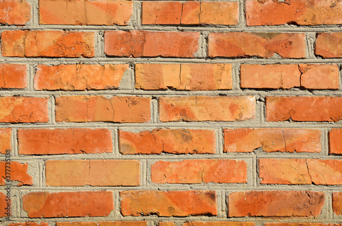 Texture of the old brick. The rough surface of a brick wall.