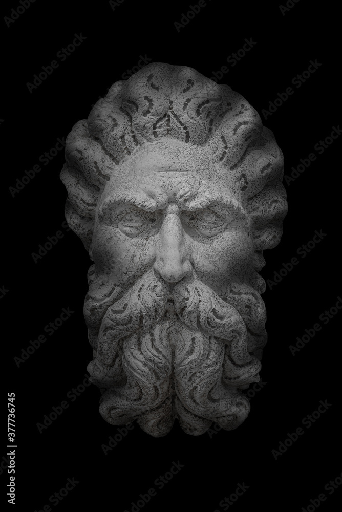 Obraz premium Portrait of ancient aged sculpture of an old Venetian bearded man in Venice at black background, Italy
