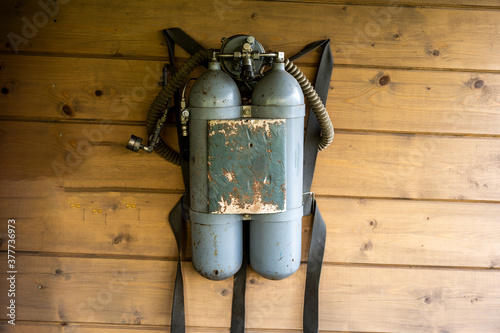 vintage diving cylinders on the wall like a trophy