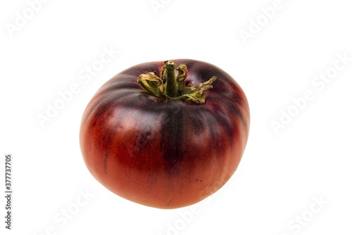 Close up macro view of ripe red tomato isolated on white background. Organic vegetables concept.