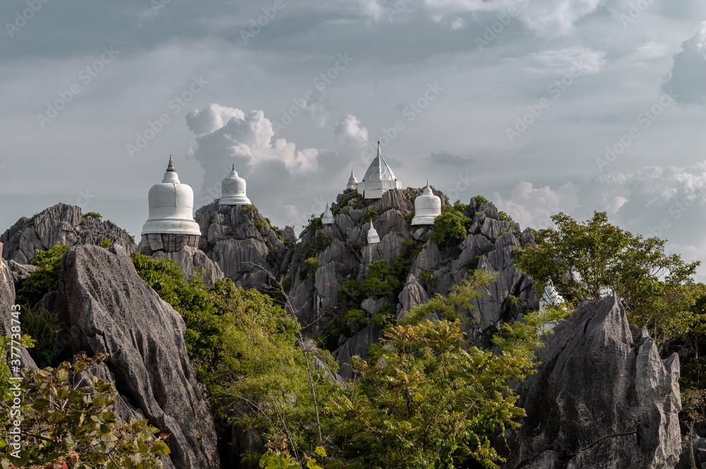Lampang, Thailand - Sep 03, 2020 : Pagoda on top of the cliff high mountain at Chaloem Phrakiat Phrachomklao Rachanuson temple (Wat Phrabat Pu Pha Daeng) Chae-Hom District, Lampang province, Unseen an