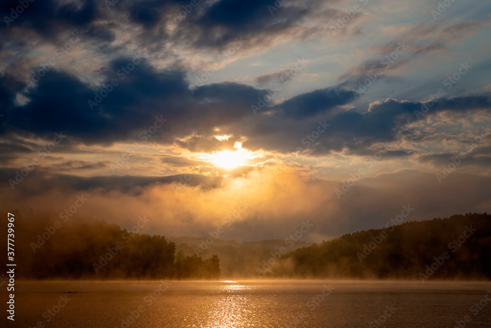 Sunrise on a misty lake Vlasina in the south of Serbia