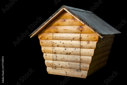 Wooden house on a black background.Model
